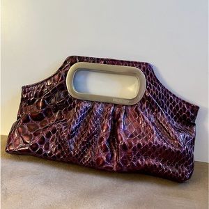 Unlisted by Kenneth Cole Clutch in Purple reptile print.